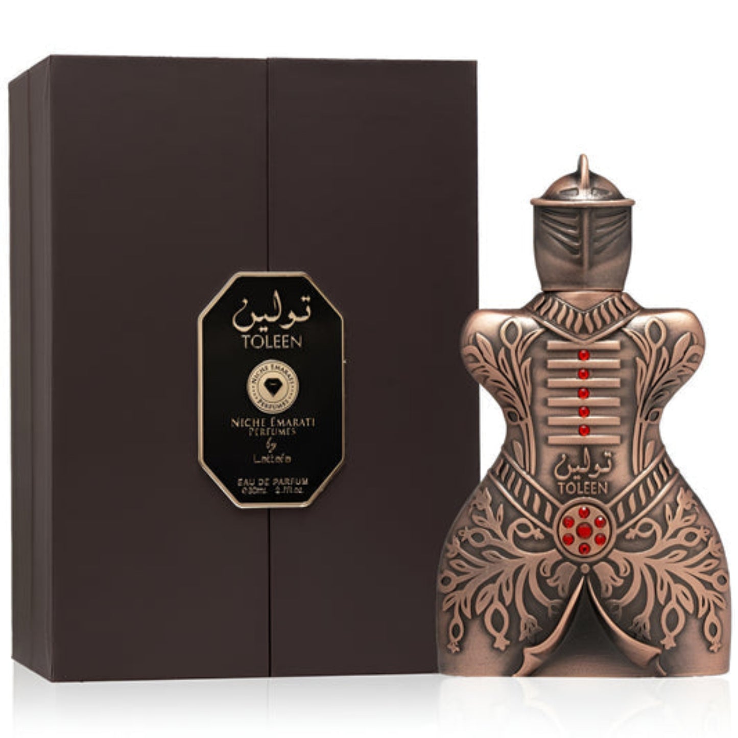 Decorative perfume bottle with intricate design next to a black box labeled 'Toleen'.