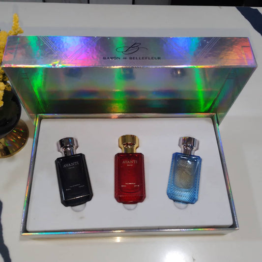 Three perfume bottles in a decorative box with a colorful lid, featuring the brand 'Baron de Bellefleur'.