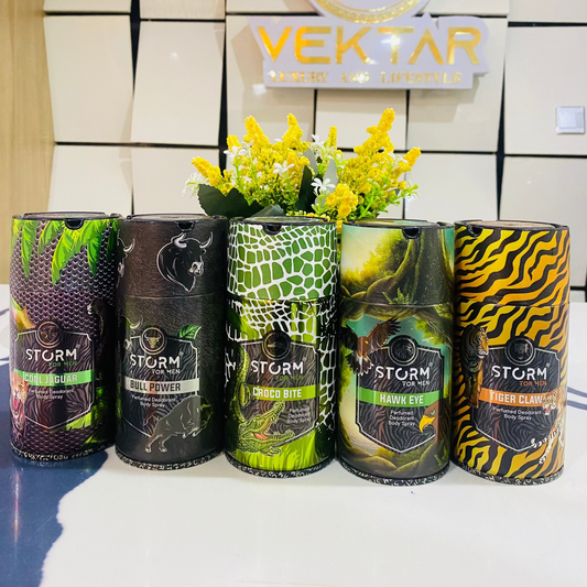 Five cans of 'Storm' with decorative flowers in front of a Vektor sign.