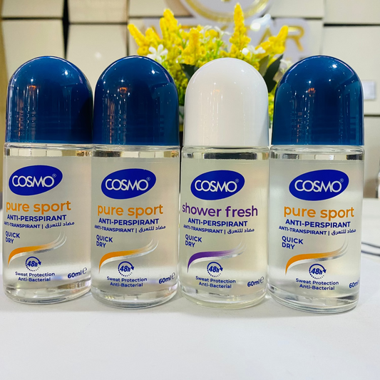 Four bottles of Cosmo deodorant on a white surface with a blurred background