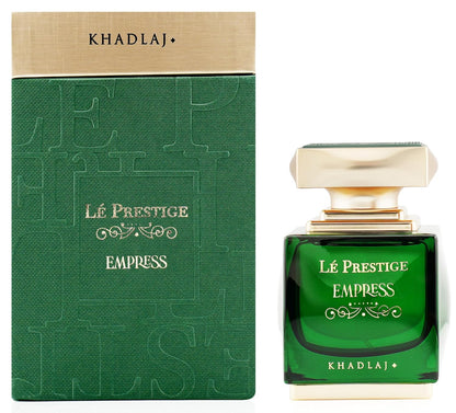 Green perfume bottle and packaging with 'Khadlaj' branding on a white background