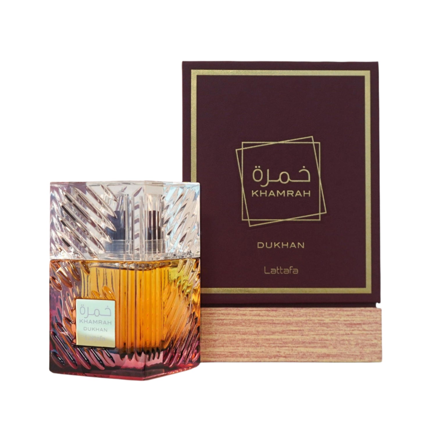 Perfume bottle with Khamrah Dukhan packaging on a white background